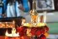 Puja oil lamps and flowers
